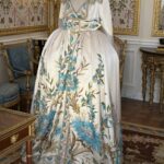 A white gown with blue florals